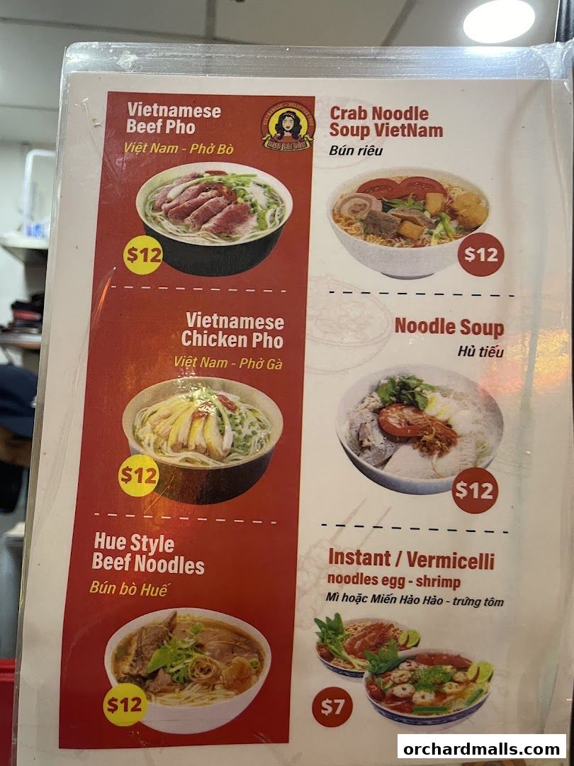 A menu from Miss Saigon Singapore featuring Vietnamese noodle dishes like Pho and Bun.