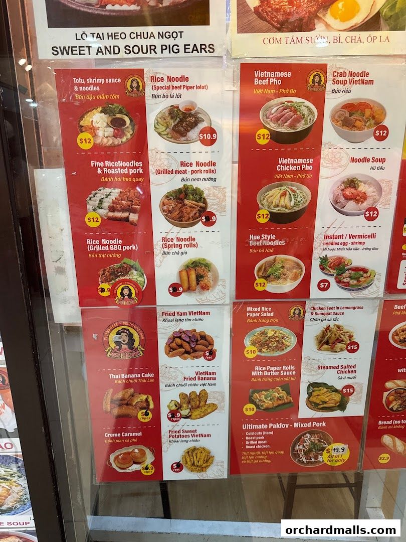 A menu board displaying various Vietnamese dishes with prices and images.