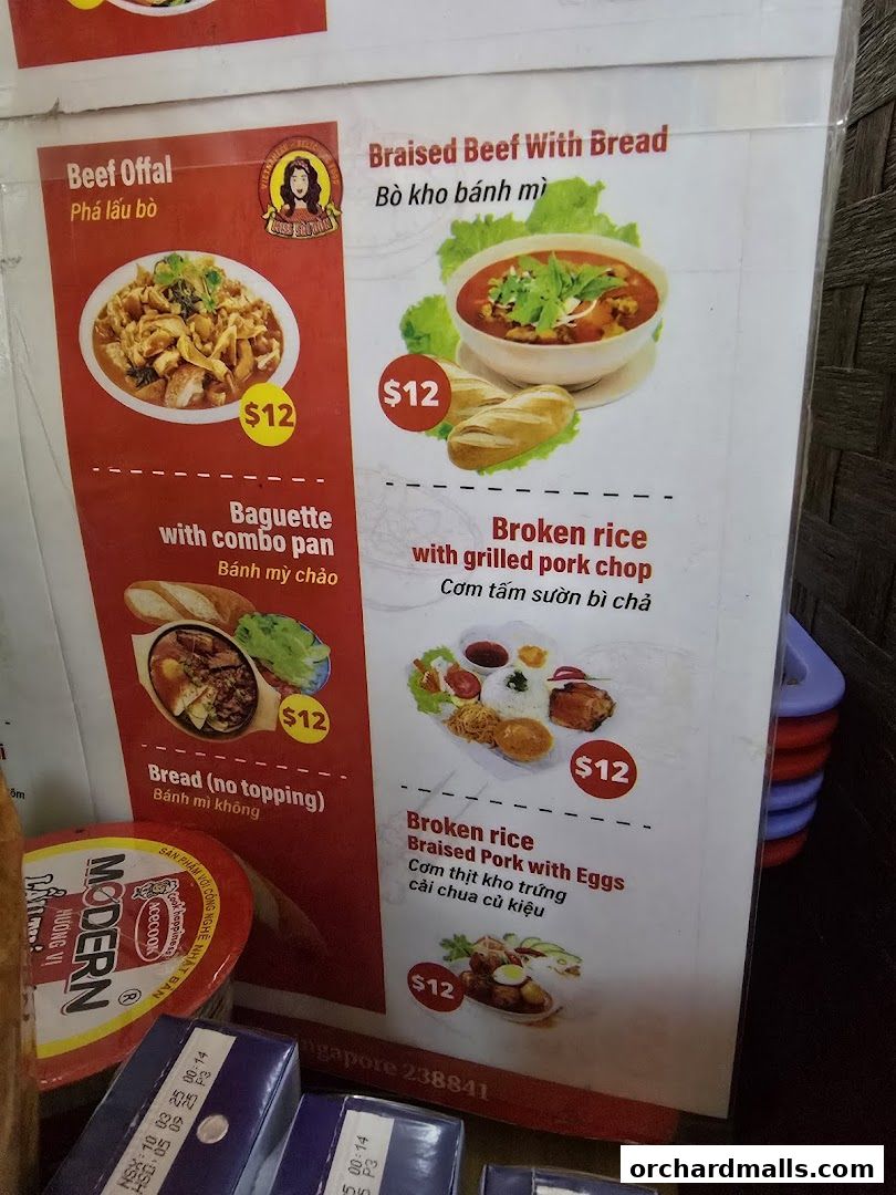 A menu board displaying Vietnamese dishes with prices and images.
