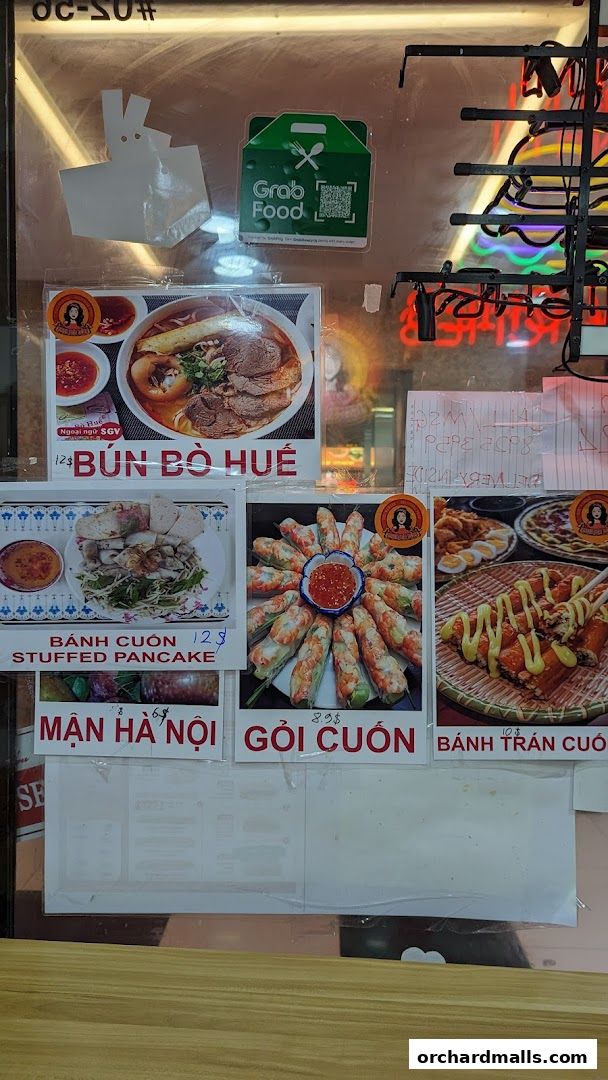 A display of Vietnamese dishes with prices and images, including Bun Bo Hue and spring rolls.