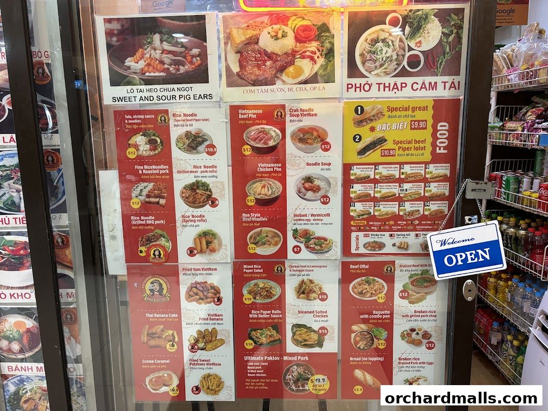 A display of Vietnamese food menu items with pictures and prices.