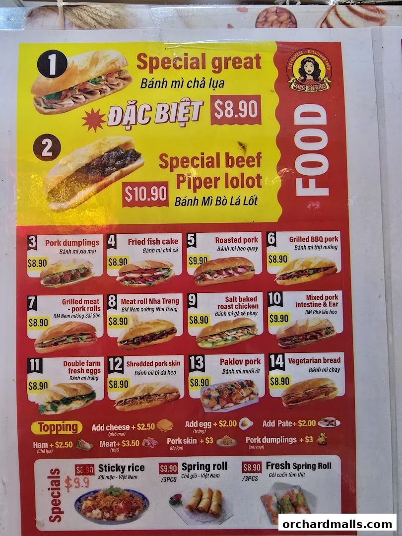 A menu board for Miss Saigon Singapore featuring various Banh Mi options and specials.
