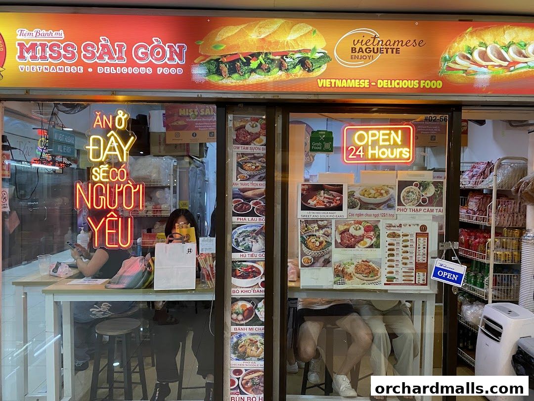 Miss Saigon Singapore shop front with Vietnamese food displayed and 'Open 24 Hours' sign.