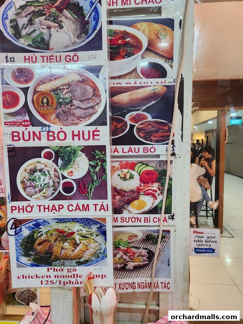 A display of Vietnamese food dishes with prices and descriptions.