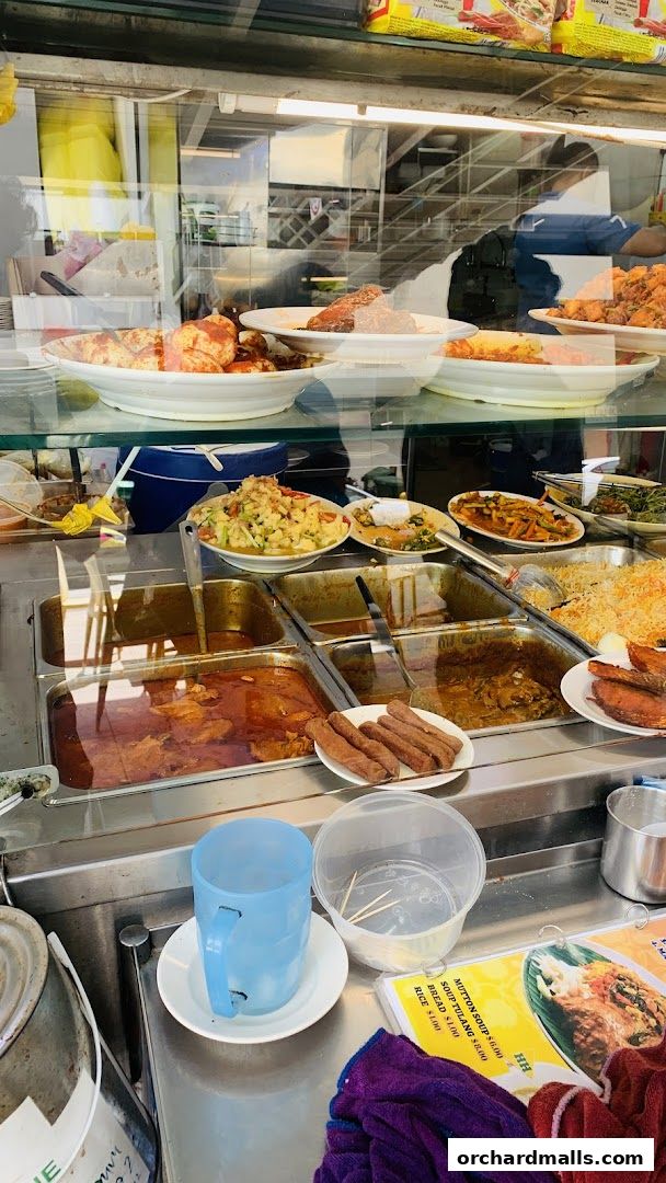 A display of various dishes and a menu at a food stall.