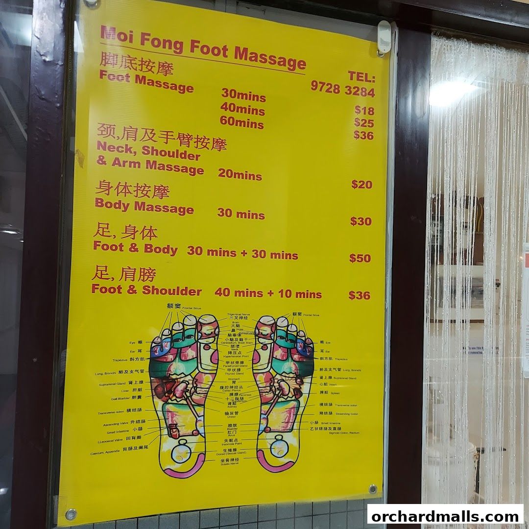 A yellow sign displays services and prices for foot reflexology and massage treatments.