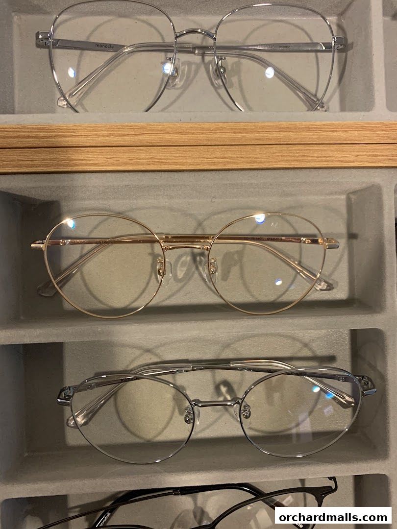 A display of stylish eyeglasses from the Monocle shop, showcasing various frame designs.