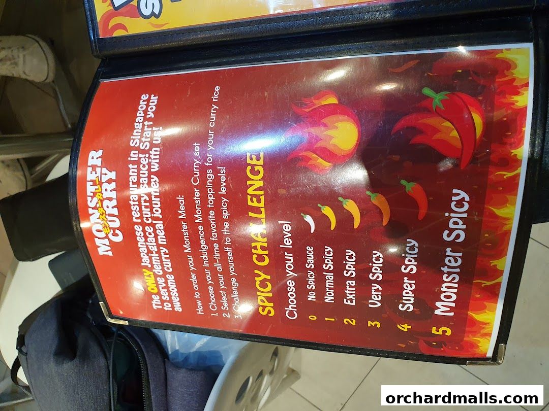 A menu from Monster Curry showcasing their spicy challenge levels.