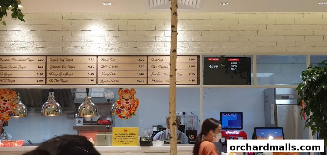 A MOS Burger menu board displaying various burgers, sides, and drinks with prices.