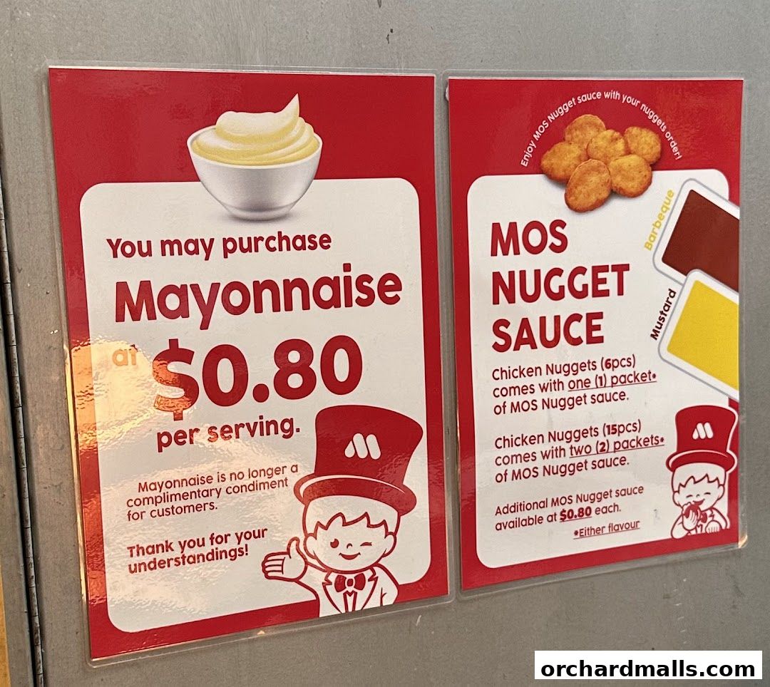 Signs advertising the purchase of mayonnaise and MOS Nugget Sauce at MOS Burger.