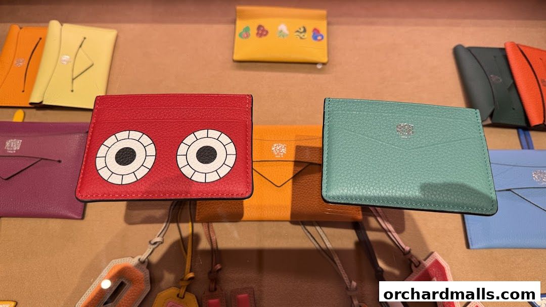 A display of colorful leather cardholders and accessories from Moynat.
