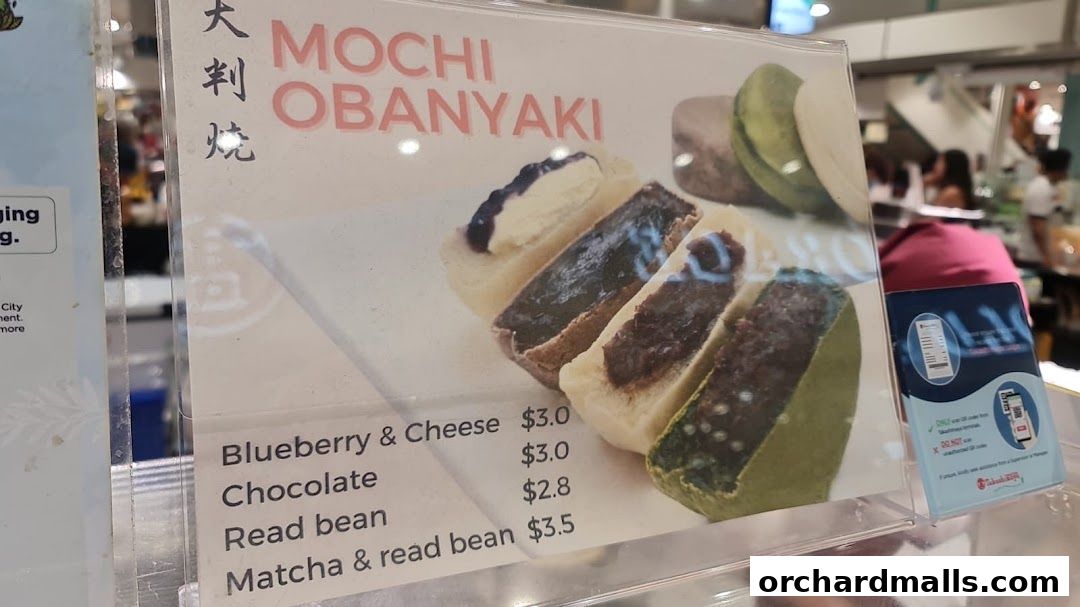 A menu board displaying various flavors of Mochi Obanyaki with prices.