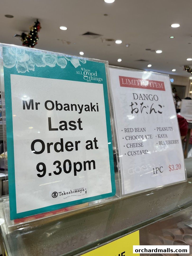 Signs for Mr Obanyaki and Dango, indicating last order time and available flavors.