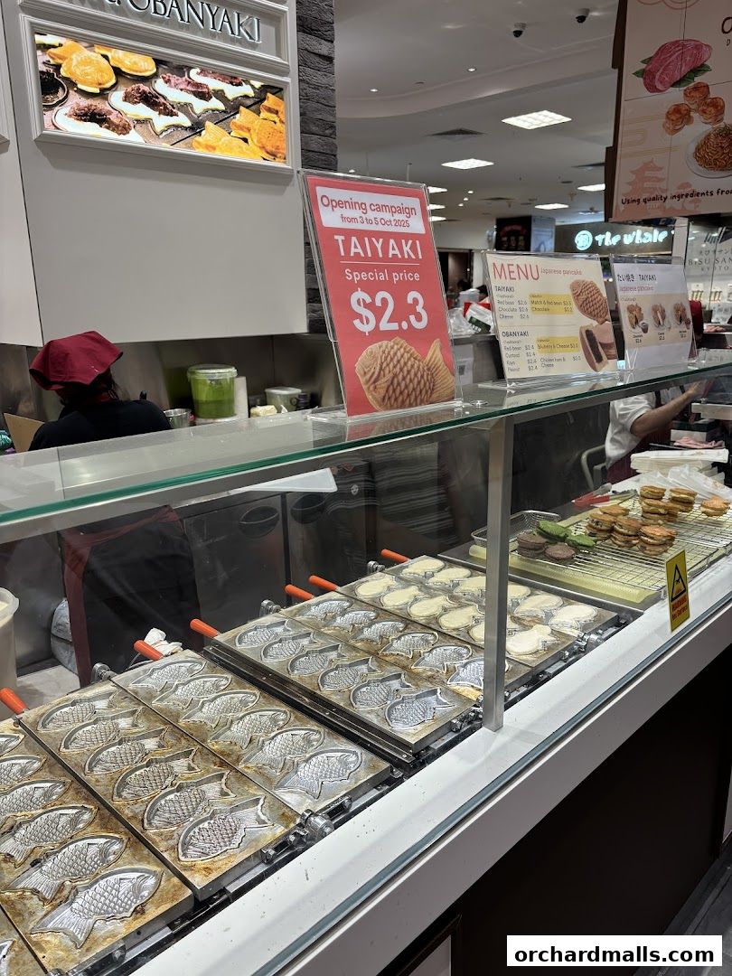 A display of Taiyaki molds and a menu at Mr Obanyaki Japanese Pancakes.