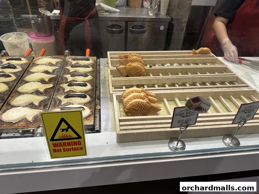 Freshly made Japanese taiyaki pancakes being prepared and displayed.