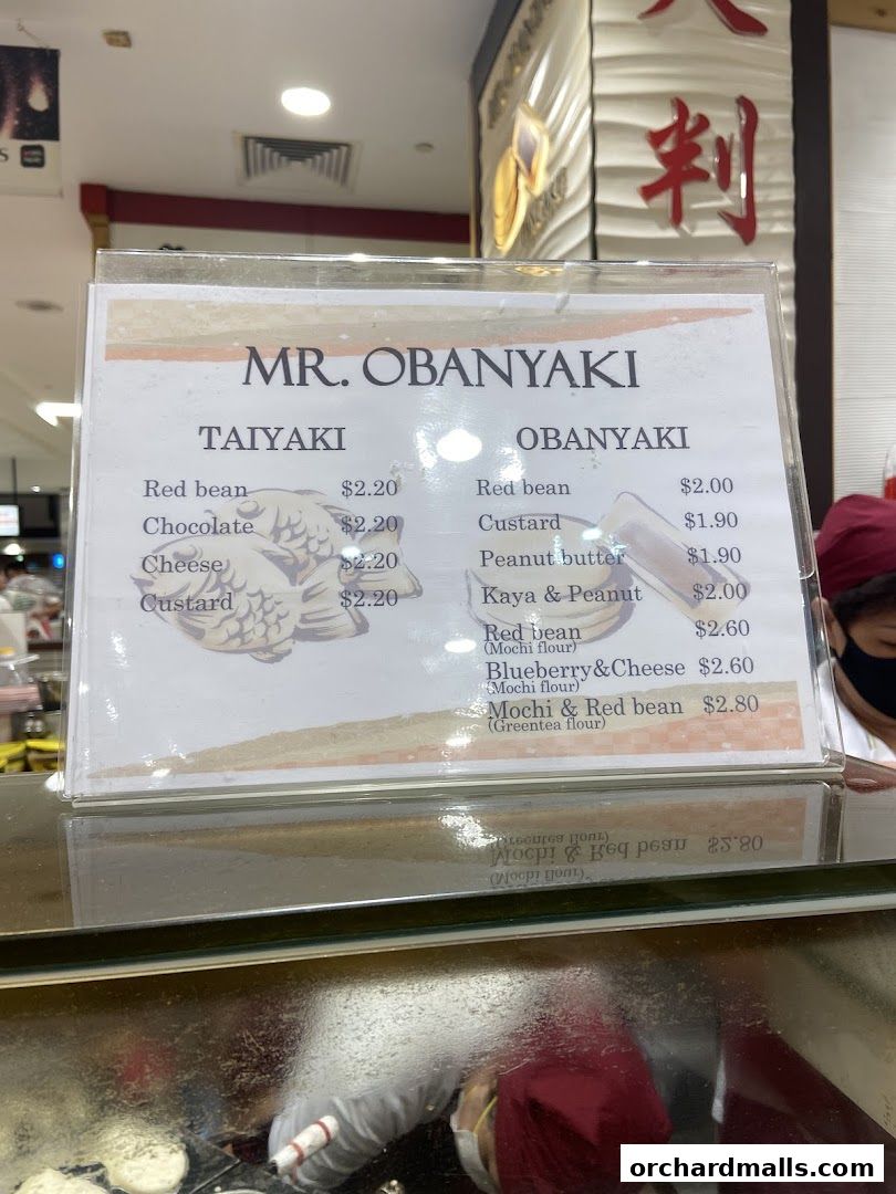 A menu board for Mr. Obanyaki featuring Taiyaki and Obanyaki pancake options.