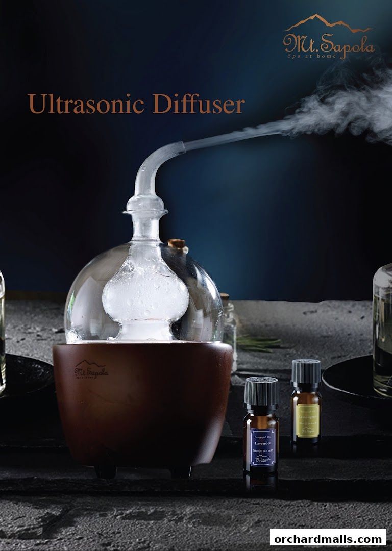 An ultrasonic diffuser with essential oils from Mt. Sapola, creating a spa-like atmosphere.