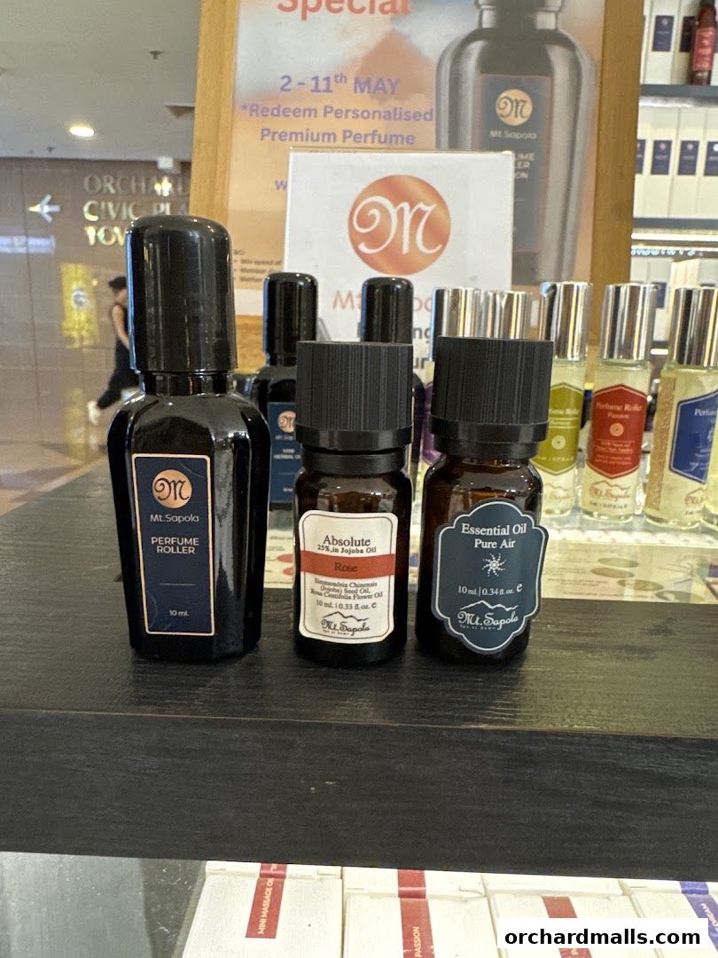 Close-up of Mt. Sapola perfume roller and essential oil bottles on display.