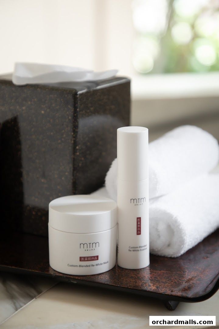 Skincare products from mtm labo, including a mask and essence, with towels and a tissue box.