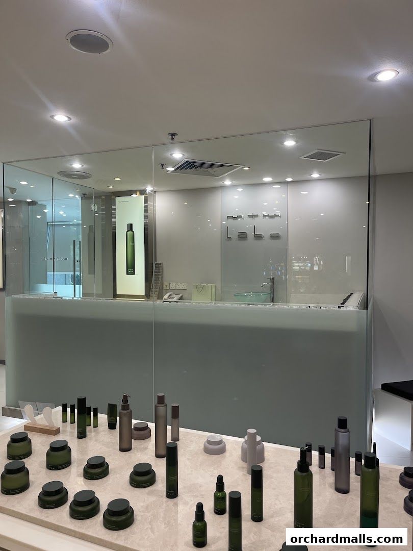 A display of skincare products in minimalist green and grey bottles at mtm labo.
