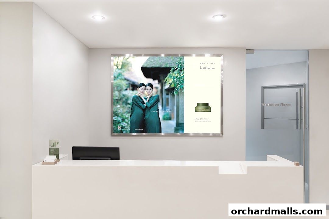 Interior shot of mtm labo Wheelock Place with a large advertisement and reception desk.
