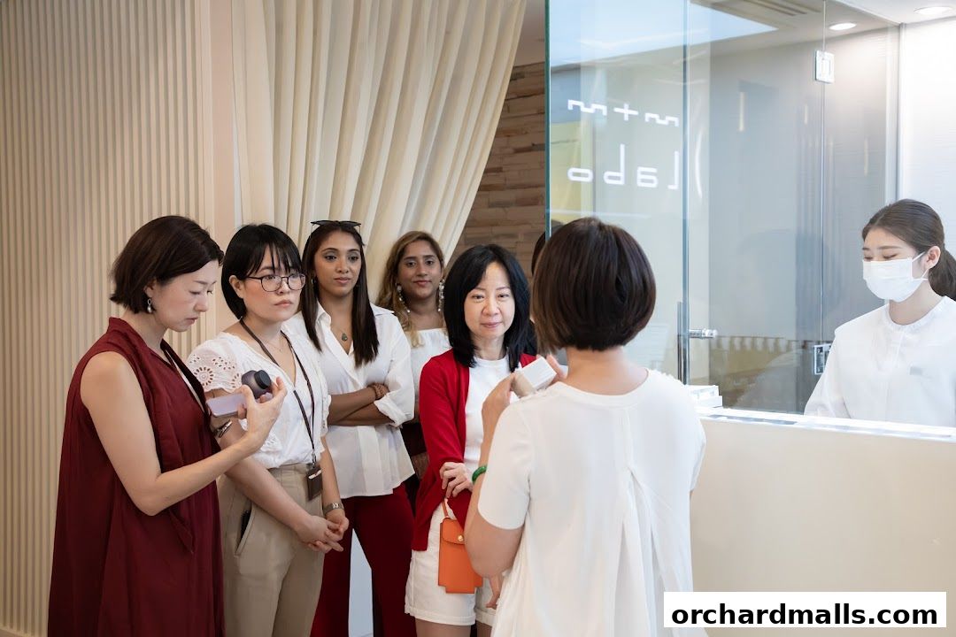 A group of women are gathered at the reception of a beauty clinic.