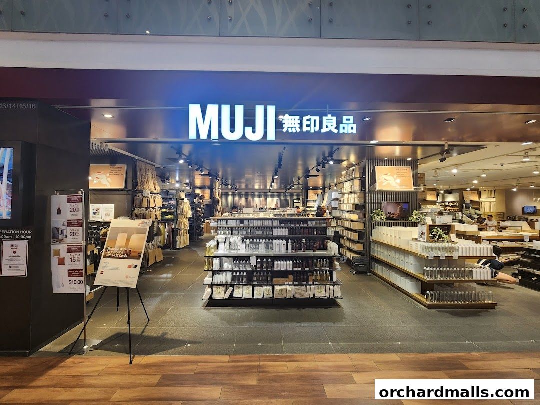 The entrance of the MUJI store at ION Orchard, showcasing various products and promotions.