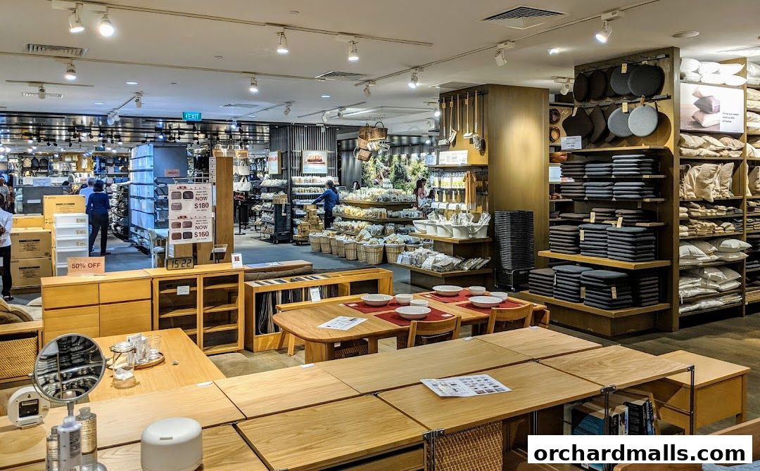 Interior view of a MUJI store showcasing furniture, home goods, and accessories.