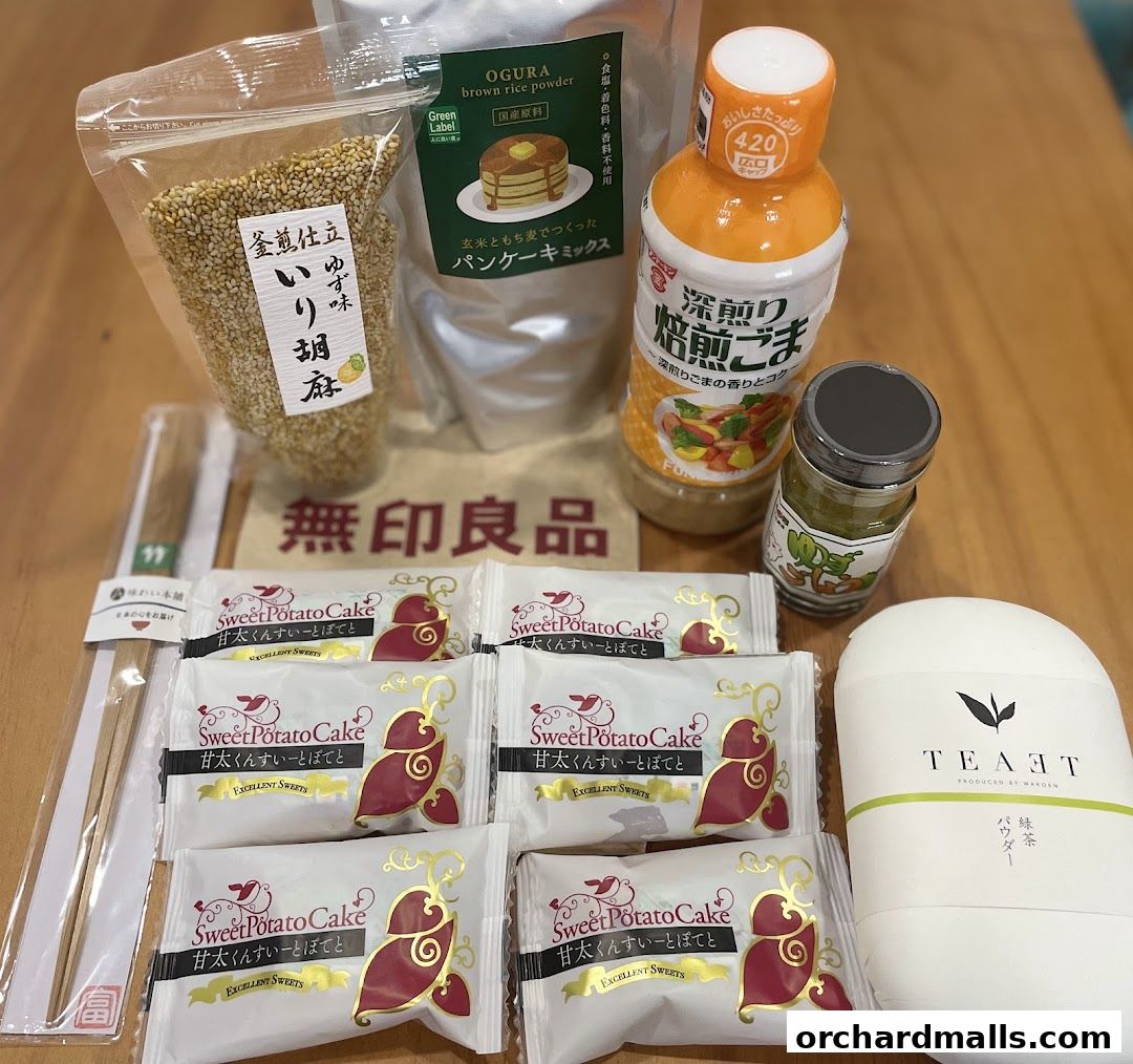 A collection of MUJI food products including pancake mix, sesame seeds, sweet potato cakes, and tea powder.