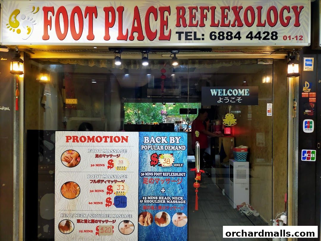 Shop front of 'My Foot Place Reflexology' with promotional offers displayed.