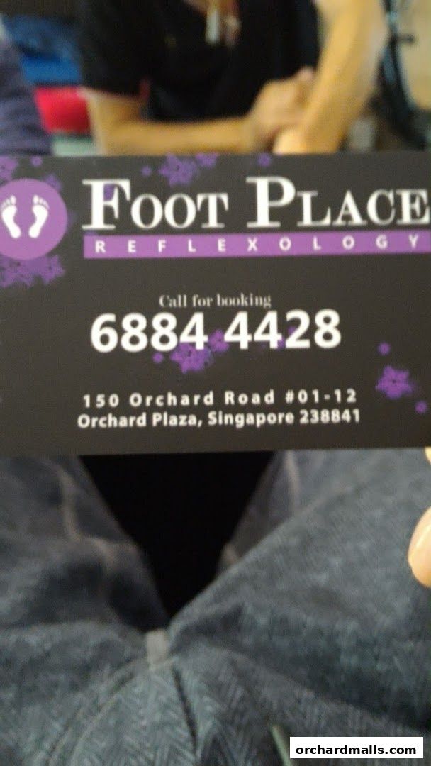 A business card for My Foot Place Reflexology, featuring contact and address details.
