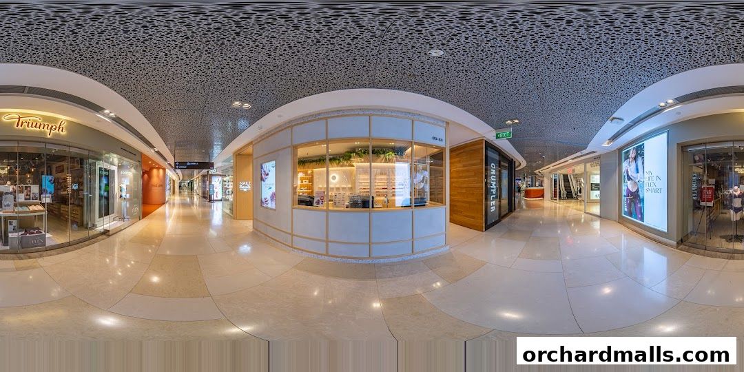 A modern nail salon with a clean, bright interior and display of nail polish bottles.