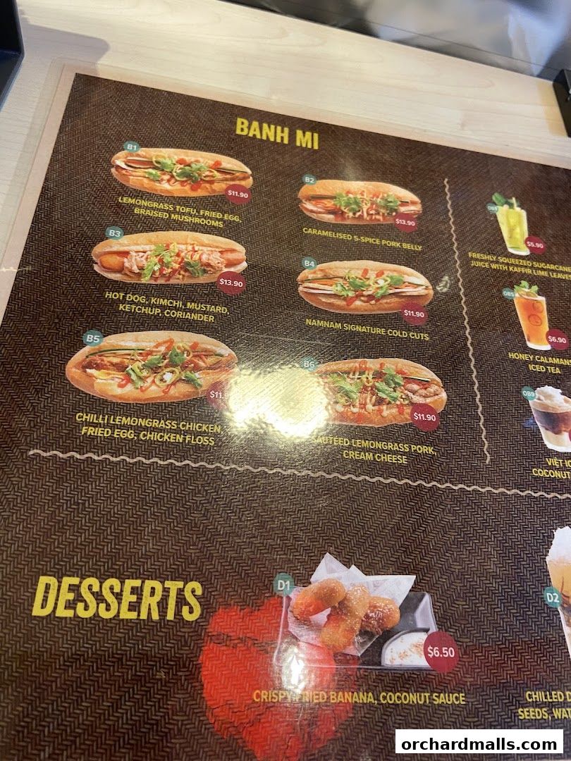 A menu featuring Banh Mi sandwiches, desserts, and drinks with prices.