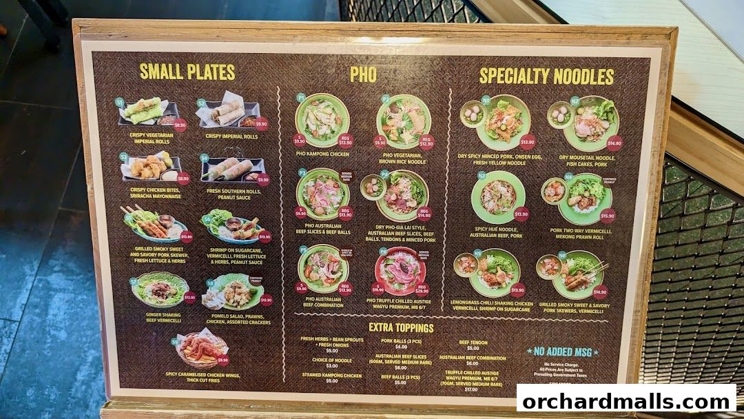 A menu board displaying Vietnamese dishes including small plates, pho, and specialty noodles.