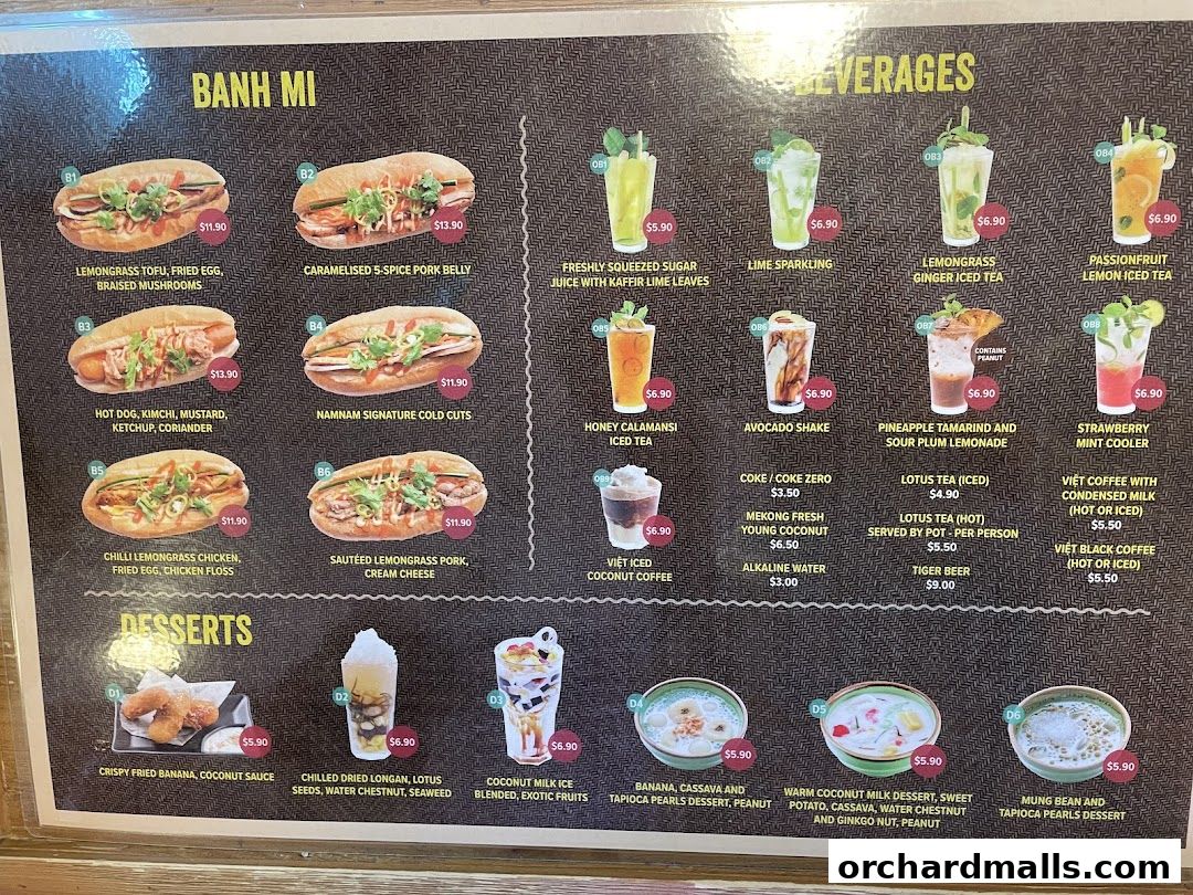 A menu board displaying Vietnamese dishes, beverages, and desserts with prices and images.