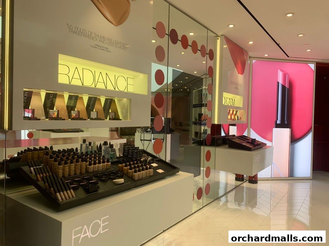 Interior view of a NARS cosmetics store showcasing makeup products and displays.