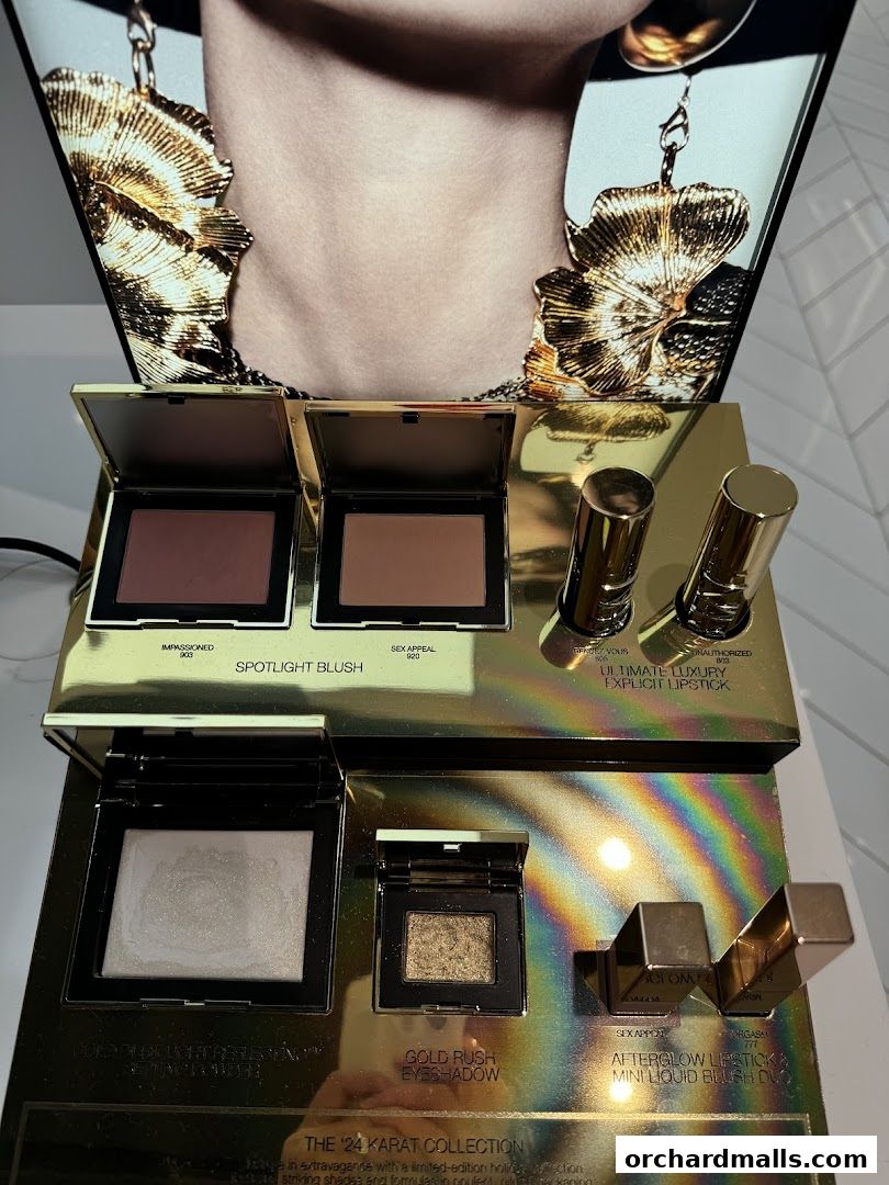 NARS makeup display featuring blushes, lipsticks, and eyeshadows from 'The '24 Karat Collection'.