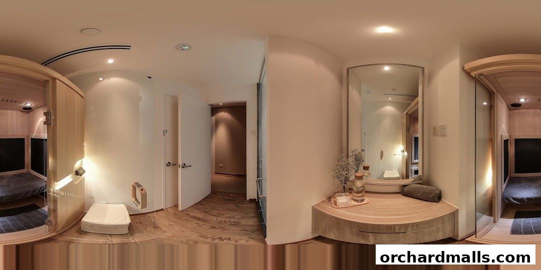 Interior view of Natures Spa, featuring a sauna room, a vanity area, and a hallway.