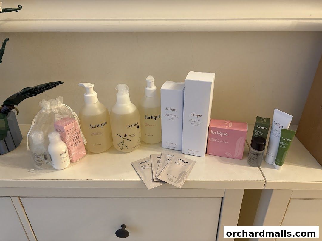 A collection of Jurlique skincare products displayed on a white dresser.