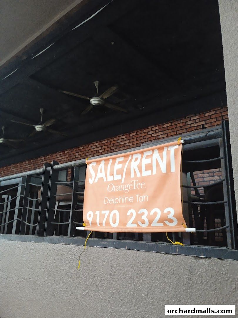 A sale/rent sign is displayed on a balcony with ceiling fans.