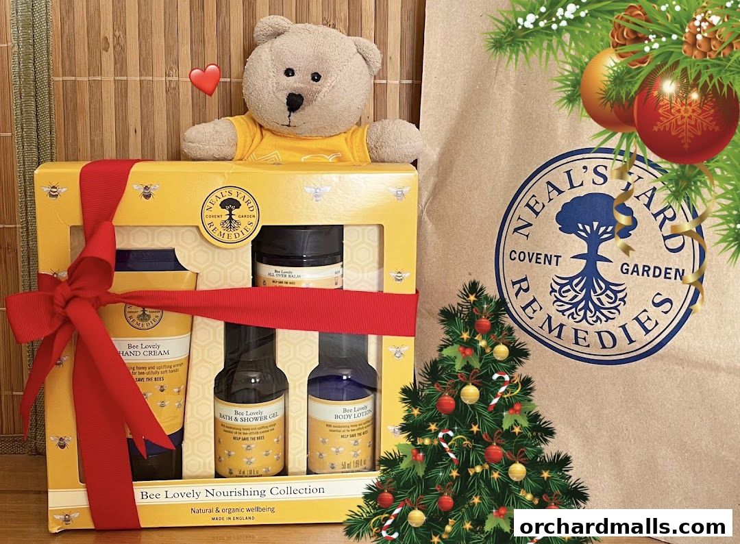 A "Bee Lovely Nourishing Collection" gift set from Neal's Yard Remedies with a teddy bear.