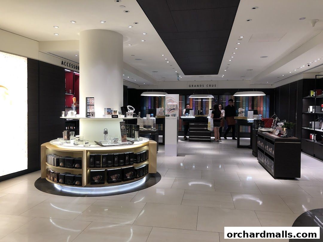 Interior of a Nespresso Boutique showcasing coffee capsules, machines, and accessories.