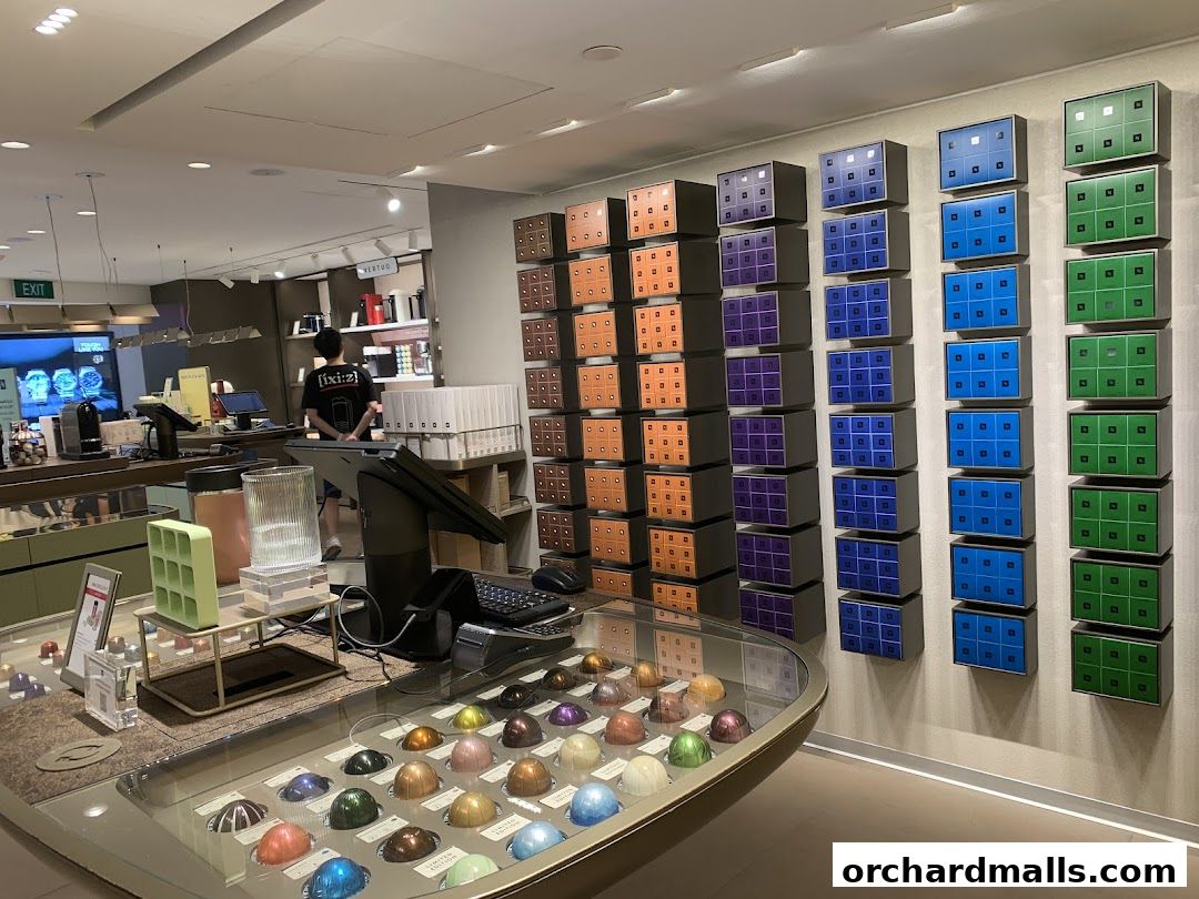 Interior of a Nespresso boutique showcasing coffee capsules and machines.