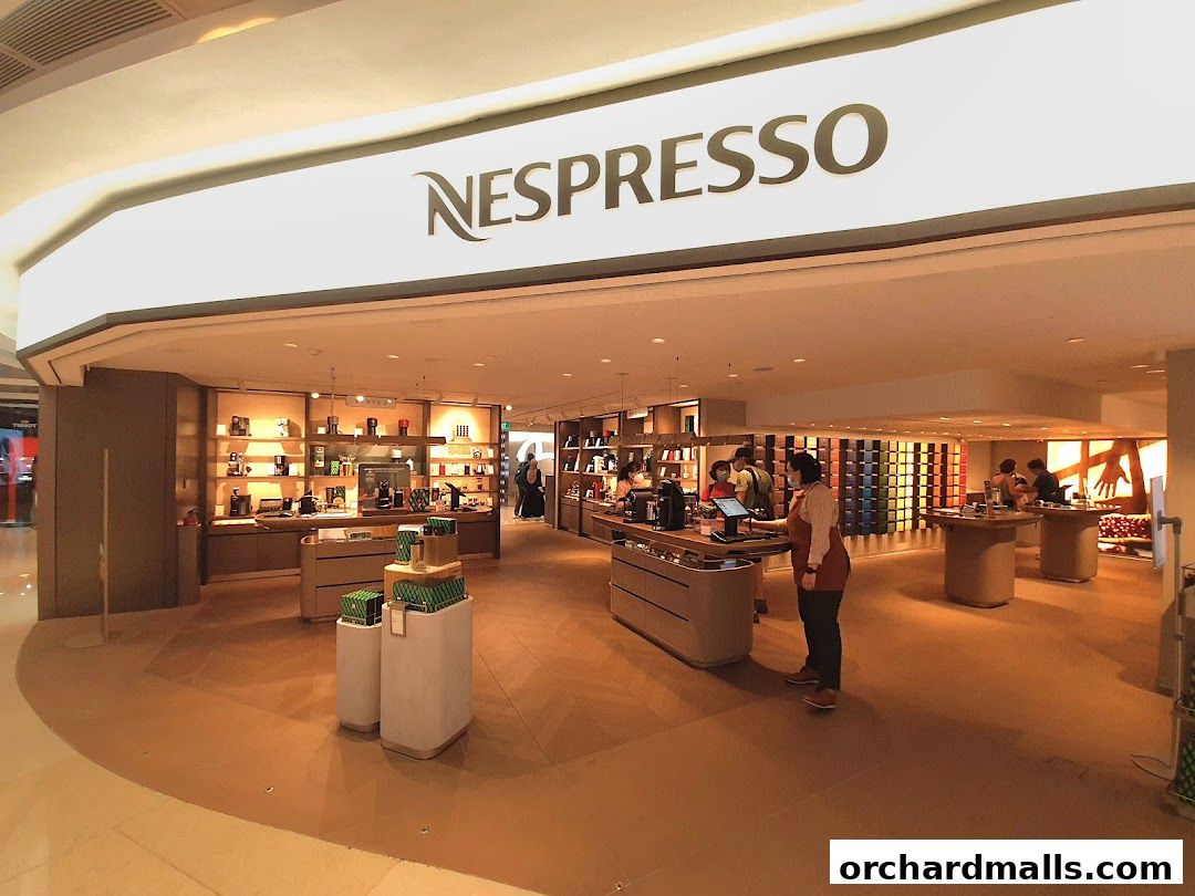 Interior of a Nespresso Boutique showcasing coffee machines and capsule collections.