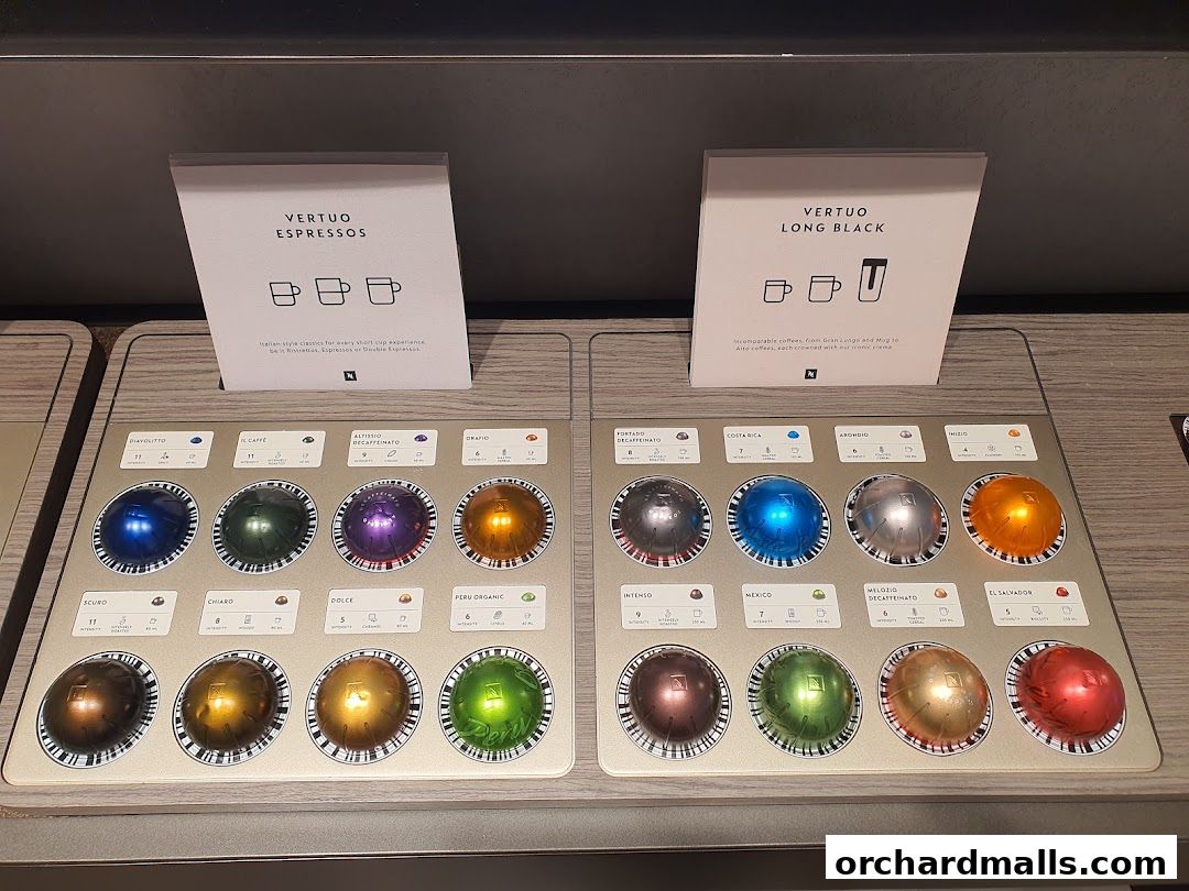 A display of Nespresso Vertuo coffee capsules in various colors and flavors.