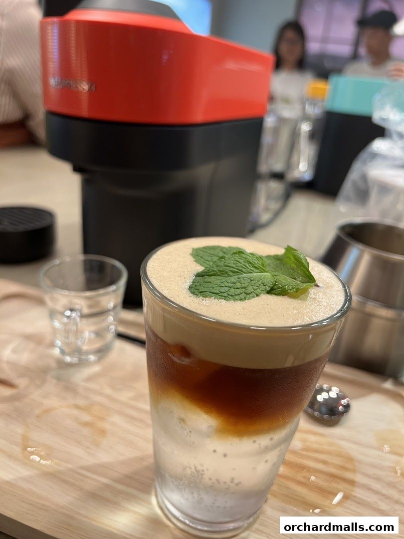A refreshing iced coffee drink with mint, prepared using a Nespresso machine.