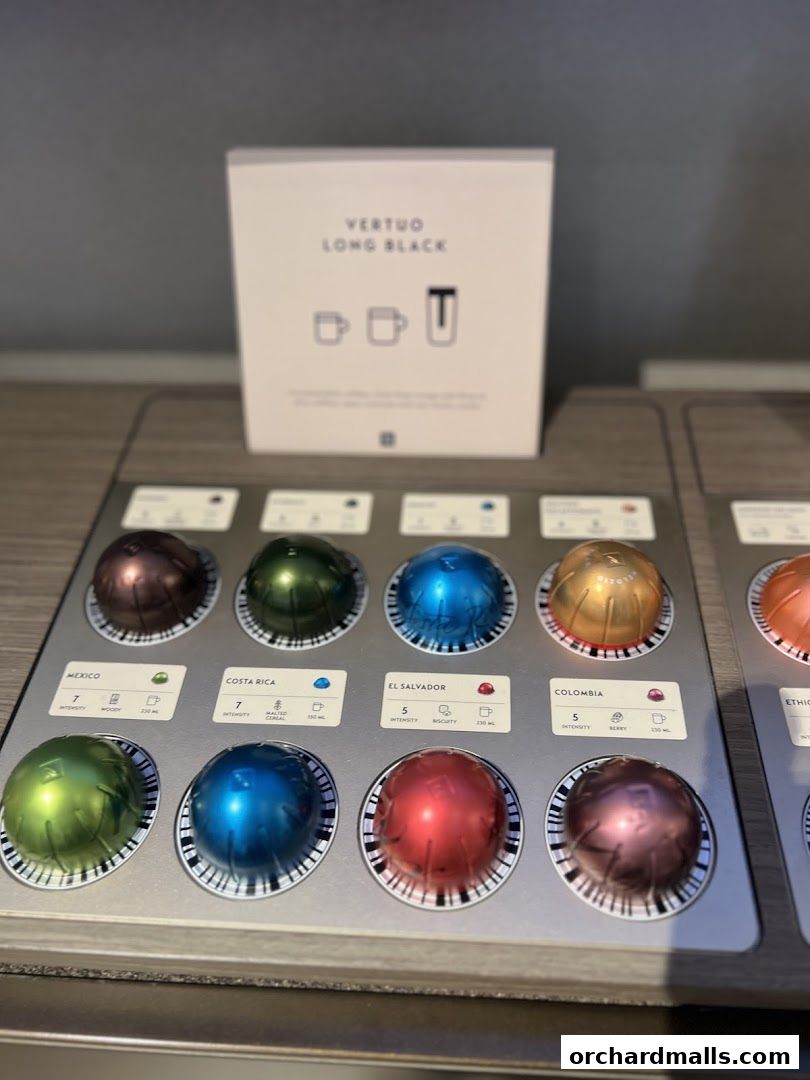 A display of Nespresso Vertuo coffee capsules with country of origin and intensity labels.