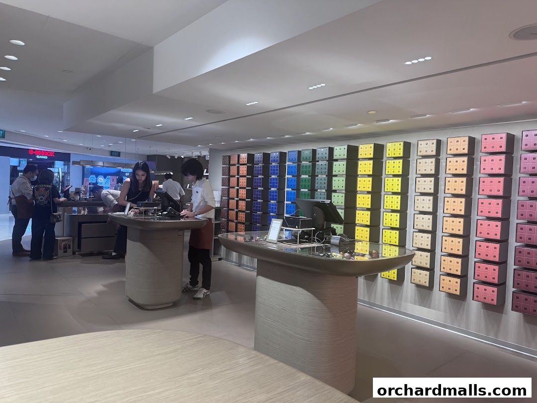 Interior of a Nespresso Boutique with colorful coffee capsules displayed on the wall.