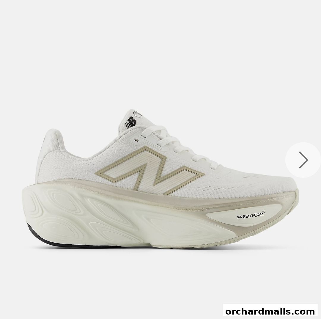 A white New Balance running shoe with a beige 'N' logo and 'Fresh Foam X' branding.