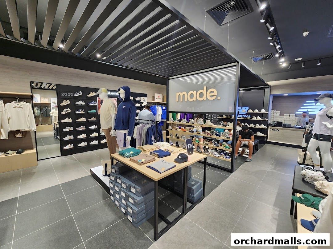 Interior view of a New Balance store showcasing shoes, apparel, and mannequins.